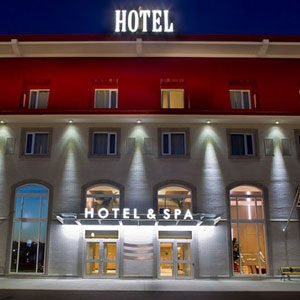 The entrance to a hotel and spa at night.